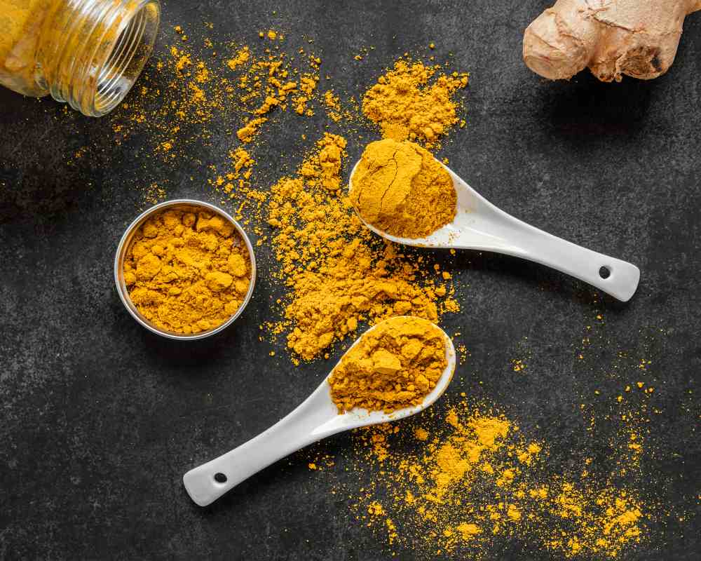 Image by <a href="https://www.freepik.com/free-photo/flat-lay-assortment-healthy-food-immunity-boosting_13108456.htm#query=turmeric%20powder%20top&position=49&from_view=search&track=ais">Freepik</a>