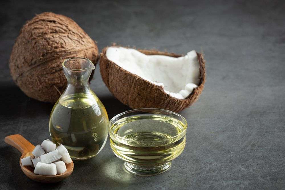 <a href="https://www.freepik.com/free-photo/jug-coconut-oil-whit-coconut-put-dark-background_10992008.htm#query=coconut%20oil&position=0&from_view=search&track=ais">Image by jcomp</a> on Freepik