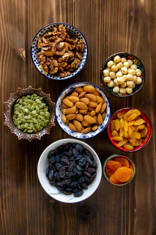 <a href="https://www.freepik.com/free-photo/top-view-mix-nuts-dried-fruits-almonds-raisins-pumpkin-seeds-with-dried-apricots-table_7802026.htm#query=dry%20fruits&position=48&from_view=search&track=ais">Image by KamranAydinov</a> on Freepik