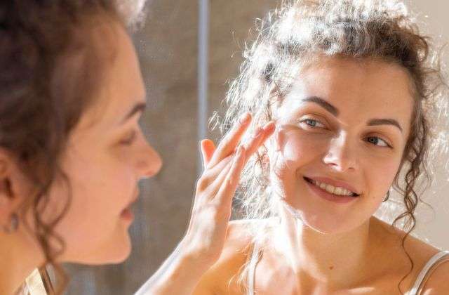 Image by <a href="https://www.freepik.com/free-photo/woman-looking-mirror-applying-face-cream_12780678.htm#from_view=detail_serie">Freepik</a>